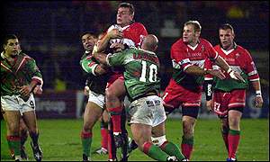 Justin Morgan of Wales is tackled by Monah Elahmed (number 10) of Lebanon