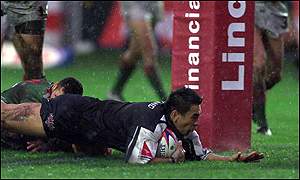 New Zealand captain Ritchi Barnett dives over the line to score.