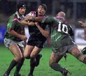 Nathan Cayless is clobbered by Lebanon's Monah El-Ahmad.