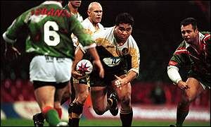 George Tuakura of the Cook Islands charges towards Lebanon's defence