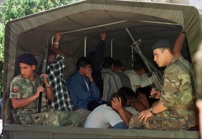 Members of the SLA under Lebanese Army arrest in the back of an army truck.