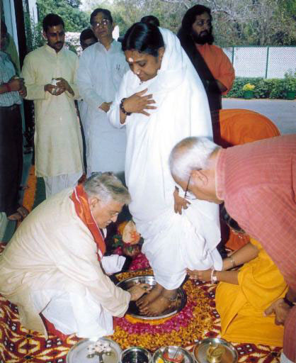 Members of Congress performing Pad Puja (worship of Amma's feet).