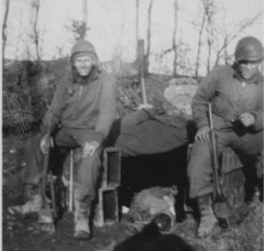 2 GI's beside dug-out (bunker)