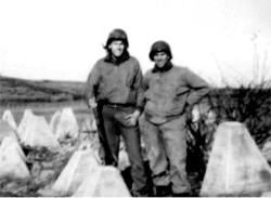 Two soldiers pose in tank trap