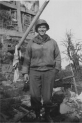Phillip Millspaugh by wreckage of farm