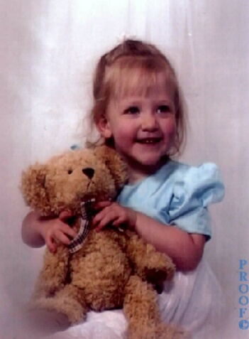 Hugging a teddy bear!