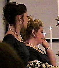 sister of the bride wipes a tear