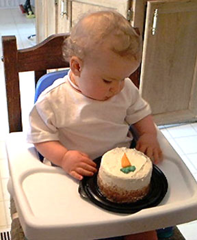 his 1st bday and he didnt know what to do with the cake.