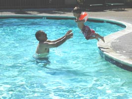 Courage to jump to Daddy. Swim class helped.