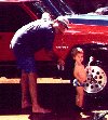 Dad and Jeffrey washin the car