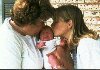 grandma and Amy give Jeffrey a smooch (less than a week old