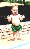 Jeffrey standing by the pool