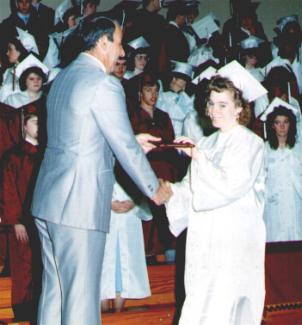 Debi Receiving her High School Diploma