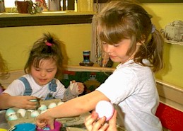 Linsey and Haley coloring eggs on April 15, 2000