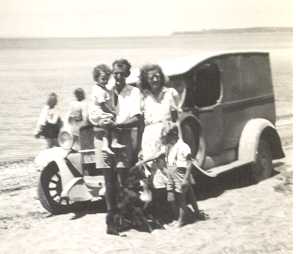 [Uncle Roy, Auntie Lillian and kids at Cornwallis Beach, with Ford Model A van]