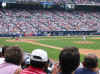 Smoltz pitching, Mets Dugout in background