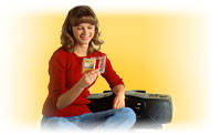 Image of a smiling young woman listening to an audio tape