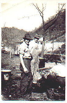 Uncle Commodore, Uncle Paul and unidentified others butchering hogs