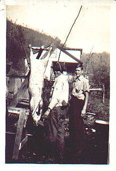  Uncle Commodore and Uncle Paul butchering hogs