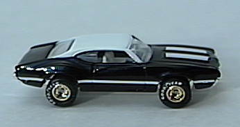 Black Olds 442 w/
gold-hubbed Real Rider tires