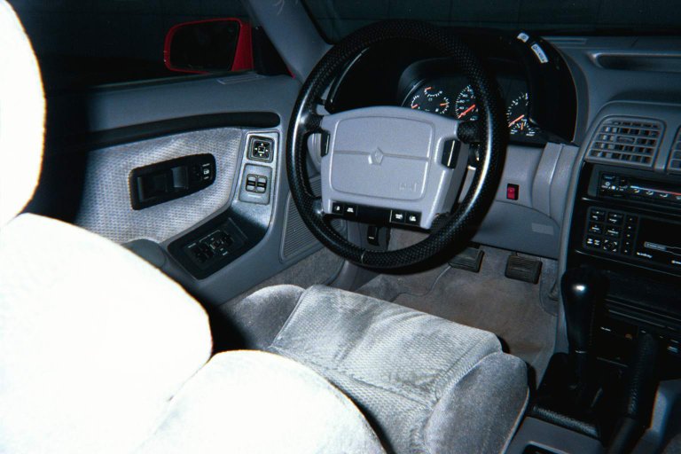 Driver's side interior photo showing door mounted controls