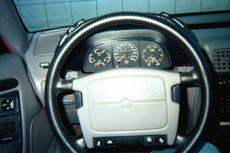 White-on-black analog instrument cluster