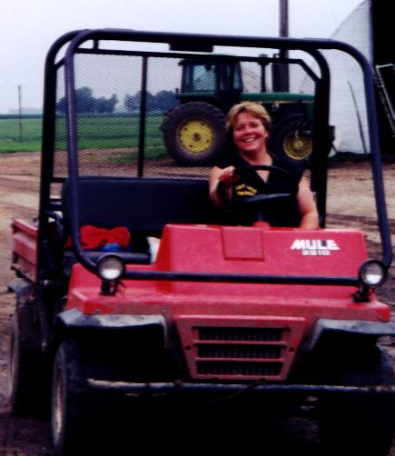 Sallie riding across the yard