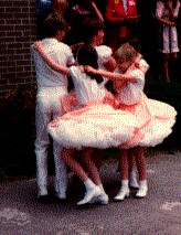 Cloggers using a square-dance pattern in routine.