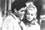 Nino Castelnuovo and Catherine Deneuve in THE UMBRELLAS OF CHERBOURG (JPG, 13 KB)
