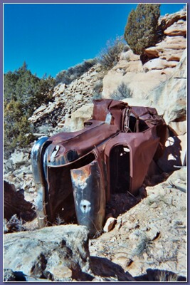 [Rusty chassis in the rocks]