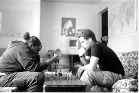 A rousing game of chess between Amina and David. 'What's that one do?'