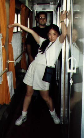 Hae-Ryong strikes a pose, Al looks on.