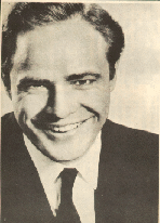 Marlon Brando in a black suit and tie, circa 1950's (I think)