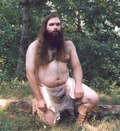 Rabbit skin loincloth, outdoors, kneeling