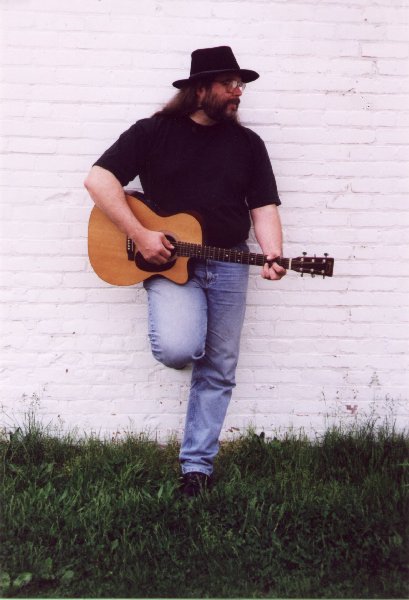Songdog with guitar