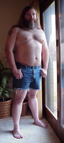 Songdog in cutoffs by doorwall