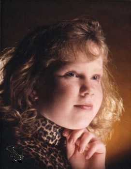 She hates this picture - she thinks she looks chubby - but I think she looks cherubic. This was taken about seven years ago.