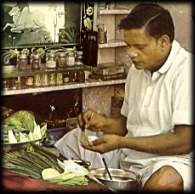 Betel leaf being rolled into a Paan