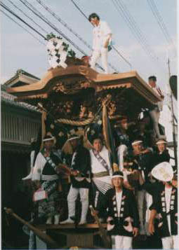 The elders riding on the front of a wagon.
