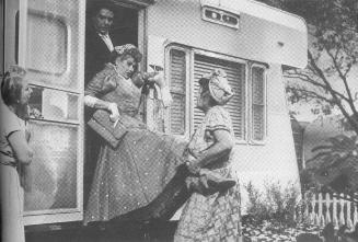 Traci is carried into her new trailer