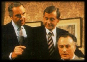 The Minister and aides in animated discussion...