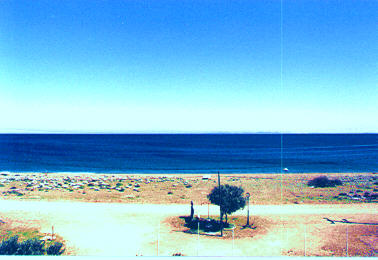 Our beach, with free sun umbrellas,of course 