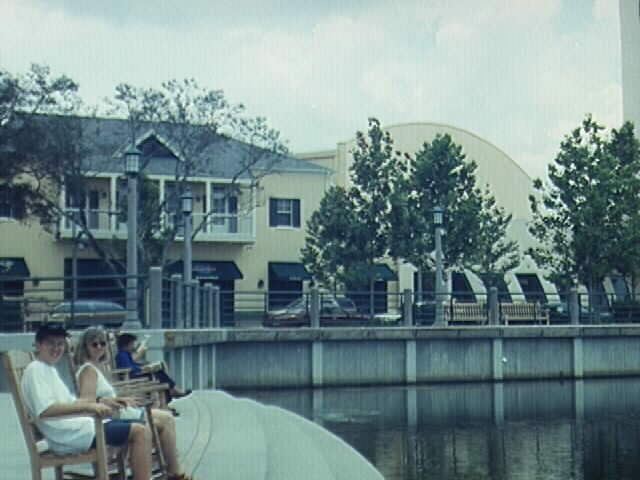 My mom and I sitting in rocking chairs in front of the lake