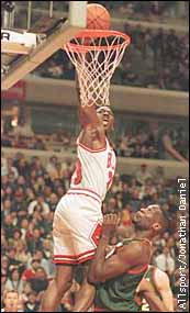 Jordan dunking over Kemp.