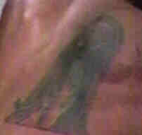 ravens ankh tattoo on his back