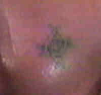 ravens ankh tattoo on his chest