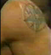 ravens ankh tattoo on his arm