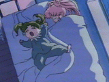 Chibiusa and Usagi, with their ages inverted, try to get some sleep on Mamoru's bed