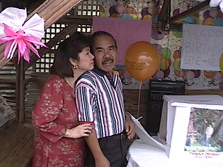 Mom kissin` dad