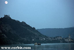 The full moon rises over the serenity of the Danube River, near Vienna, Austria - Click to hear Strauss Blue Danube Waltz.